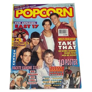 May include: A magazine cover featuring a group of young men, with the title "POPCORN" in large yellow letters. The cover features the text "Take That" in large white letters, and the text "East 17" in smaller white letters. The magazine cover is a bright red, yellow, and white color scheme.