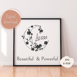 Puede incluir: Impresión de arte imprimible en blanco y negro con un diseño floral en forma de media luna. El texto "Liessa" está escrito en cursiva dentro de la luna. El texto "Beautiful & Powerful" está escrito debajo de la luna. La impresión está enmarcada en un marco negro.