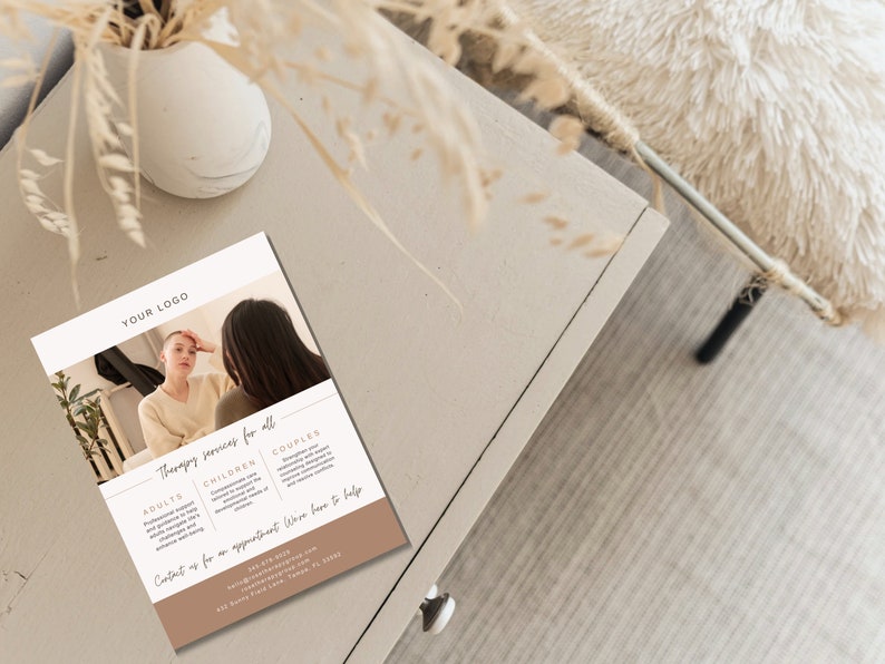 May include: A flyer with the text "YOUR LOGO" at the top, and "Therapy services for all" in the center. The flyer includes information for adults, children, and couples. The flyer is on a neutral-toned surface.