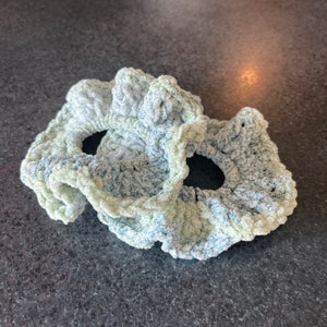 Two blue and green velvet scrunchies
