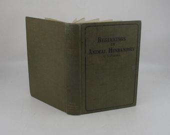 May include: A green hardcover book titled "Beginnings in Animal Husbandry" by C.S. Plumb.