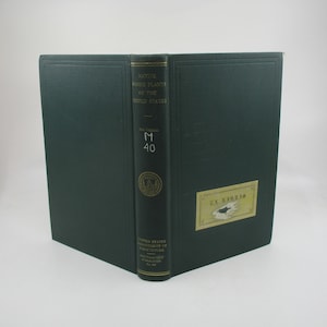 May include: A dark green hardcover book titled "Native Food Plants of the United States" with the text "Ex Libris" on the front cover. The book is part of the "U.S. Department of Agriculture" series and has the number "M 40" on the spine.