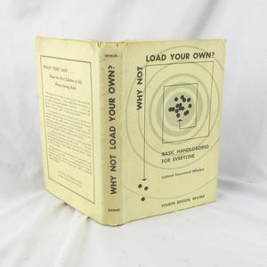 May include: A vintage book titled "Why Not Load Your Own?" with a light yellow cover. The cover features text and a target graphic. The book's spine reads "Why Not Load Your Own?" and "Barnes."