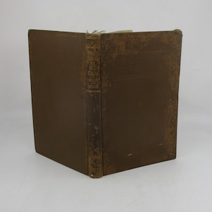 May include: A brown leather-bound book with gold lettering on the spine. The title is "The High School Speaker".