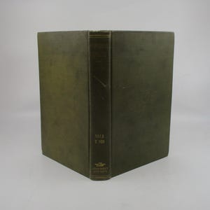 May include: A green hardcover book titled "Universal  Cyclopedia" with the numbers "5518 T 100" on the spine. The book is published by John Wiley and Sons.