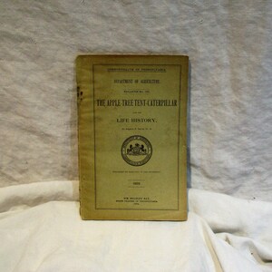 May include: A yellow pamphlet titled "The Apple-Tree Tent-Caterpillar and its Life History." The pamphlet is from the Commonwealth of Pennsylvania Department of Agriculture and was published in 1903.