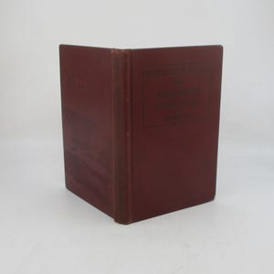 May include: A burgundy hardcover book with the title "HANDBOOK OF BUSINESS CORRESPONDENCE" and the author "PARK &  TY" printed on the spine.