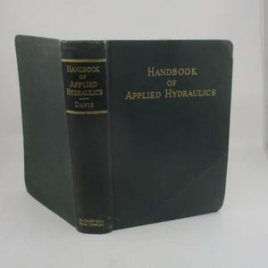 May include: A dark green hardcover book titled "Handbook of Applied Hydraulics" by Davis. The book is published by McGraw-Hill Book Company.