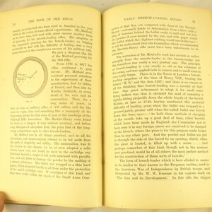 May include: An open book with aged pages, discussing early breech-loading rifles and the Metford grooving for the .303 rifle. The text is in English and includes a diagram and historical details about firearms.