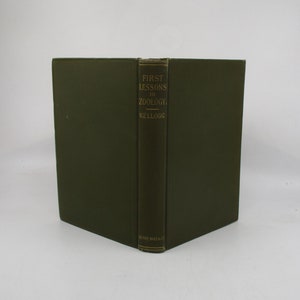 May include: A dark green hardcover book titled "First Lessons in Zoology" by Kellogg. The book is published by Henry Holt & Co.