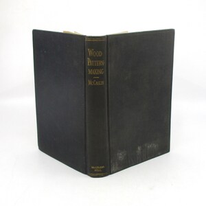 May include: A black hardcover book titled "Wood Pattern Making" by McCaslin, published by McGraw-Hill.