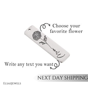 May include: A silver bar pendant with a delicate line drawing of a flower and the word "Mom" engraved on it. Choose your favourite flower and write any text you want.