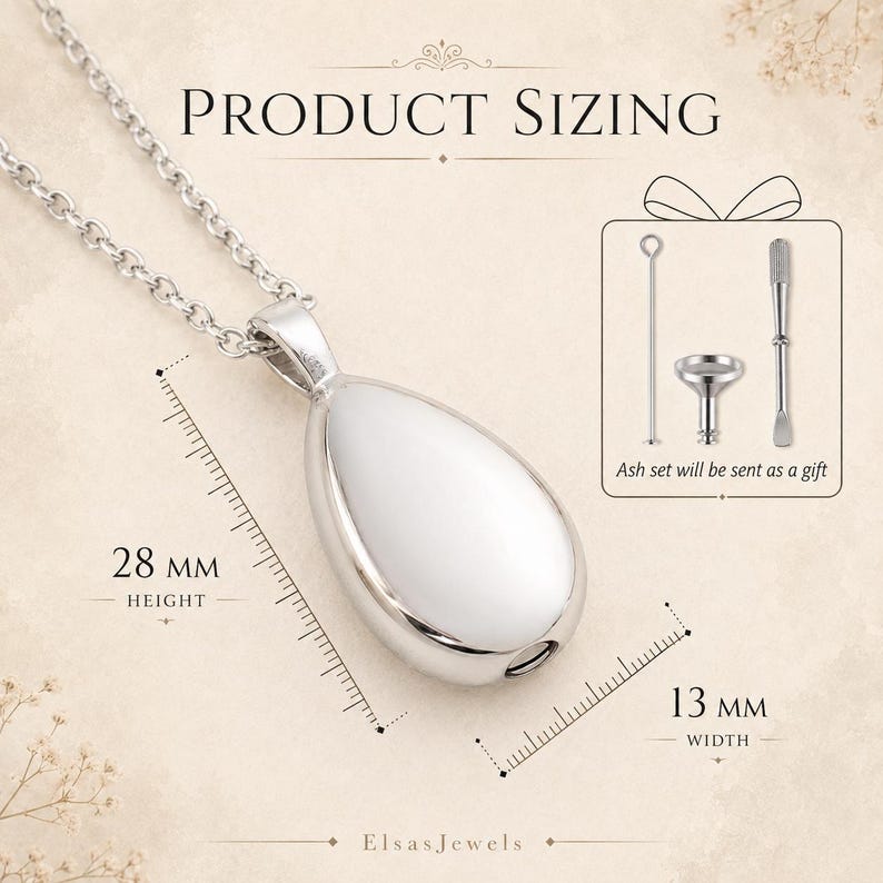 Op de afbeelding: Een zilverkleurige druppelvormige hangerketting met een witte, glanzende kern. De hanger is 28 mm hoog en 13 mm breed. De afbeelding bevat een kleine assenset als cadeau.