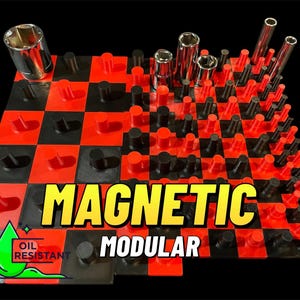 May include: A modular magnetic socket organiser in red, black, and silver. The organiser features a checkerboard design and holds various sockets and extensions. The text "MAGNETIC MODULAR" is displayed.