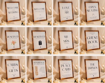 May include: Forty minimalist wedding signs with a wooden frame. The signs feature various wedding-related phrases, such as "Welcome to our Wedding", "Love is in the Air", "Reserved", "Mr. and Mrs.", "Guest Book", "Cards & Gifts", "Marriage is a Game of Love", "Place Card", and "The Drinks are on Us".