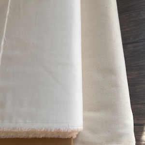 white and cream fabric. white on left