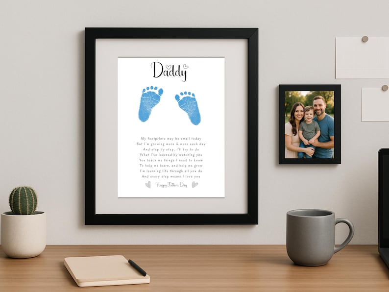 May include: A framed print with a blue baby footprint design and a poem that reads "Daddy, My footprints may be small today, But I'm growing more & more each day, And step by step, I'll try to do, What I've learned by watching you, You teach me things I need to know, To help me love, and help me grow, I'm learning life through all you do, And every step means I love you, Happy Father's Day".