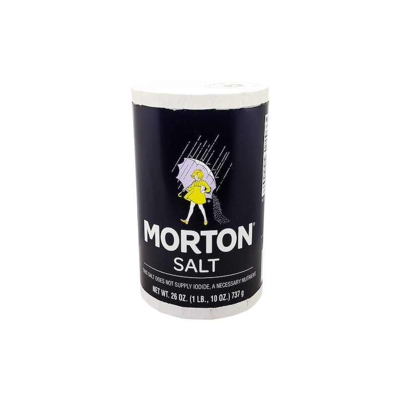 May include: A blue and white cylindrical container of Morton Salt. The container features a girl walking with an umbrella in the rain. The text on the container reads "Morton Salt" and "Net Wt. 26 oz. (1 lb., 10 oz.) 737 g".