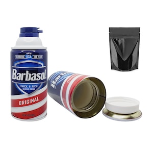 May include: A blue and red can with the words "Barbasol" and "Original" printed on it. The can is a shaving cream container that has been modified to be a secret stash container. The can is open and the lid is off. The can is sitting on a white surface.