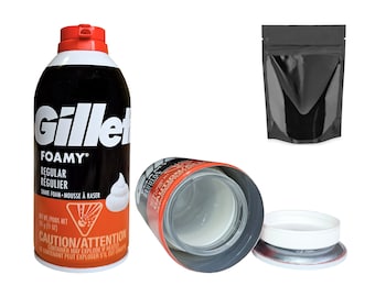 May include: A can of Gillette Foamy Regular Shave Foam with a red and white label. The can is open and the inside is visible. The can is next to a black plastic bag and a white plastic lid.