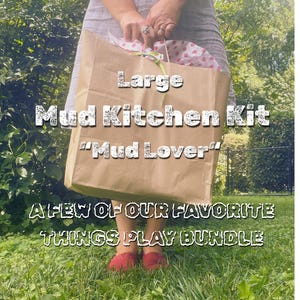 May include: A large brown paper bag labeled "Large Mud Kitchen Kit" and "Mud Lover" is held by a person. The bag contains pink and white patterned tissue paper. The text "A FEW OF OUR FAVORITE THINGS PLAY BUNDLE" is also visible.