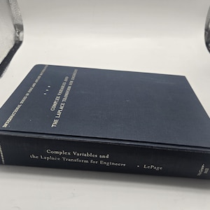 Puede incluir: Un libro de tapa dura azul oscuro titulado "Complex Variables and the Laplace Transform for Engineers" de LePage. El libro forma parte de la "International Series in Pure and Applied Mathematics".