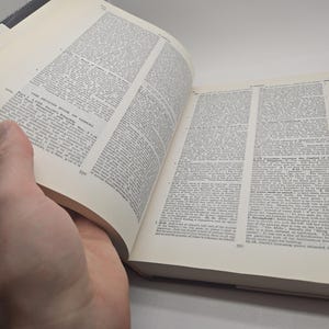 May include: An open book with white pages and black text. The book is titled "The Second Book of Samuel" and the text is from the Bible.