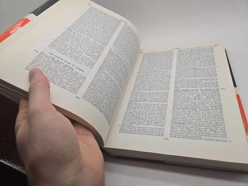 May include: An open book with white pages and black text. The book is titled "The Second Book of Samuel" and the text is from the Bible.