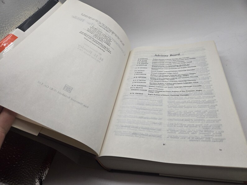 May include: A white book with a black spine. The book is open to a page with a list of names and titles under the heading "Advisory Board".