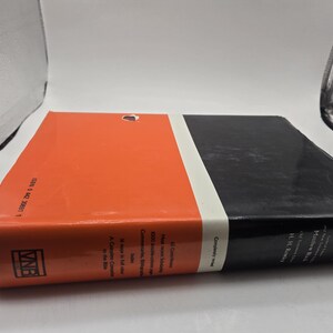 May include: A red and black hardcover book with the title "Peake's Commentary on the Bible" and the author's name "Matthew Black and H.H. Rowley".