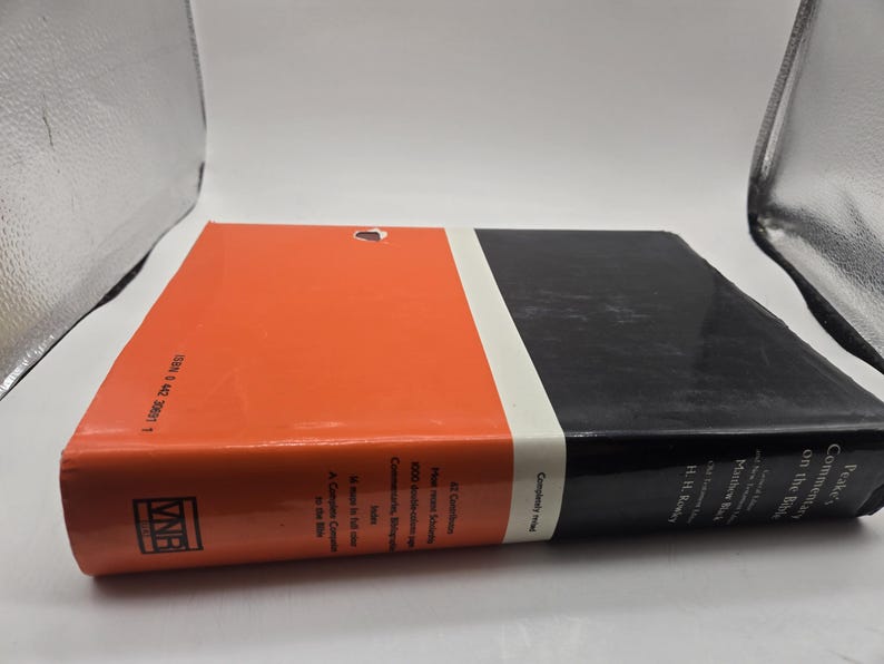 May include: A red and black hardcover book with the title "Peake's Commentary on the Bible" and the author's name "Matthew Black and H.H. Rowley".