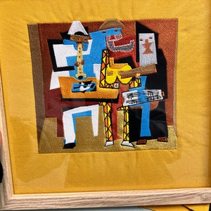 Embroidered reproduction of Picasso’s 3 Musicians