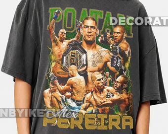 May include: A charcoal gray short-sleeve t-shirt featuring a graphic print of mixed martial artist Alex Pereira. The design includes multiple action shots of the fighter, the text POATAN at the top, and PEREIRA at the bottom in gold lettering.