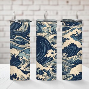 May include: Three stainless steel tumblers with a blue and white wave pattern. The tumblers are insulated and have a lid.