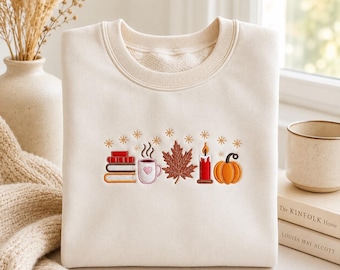 Bluza z haftem "Książkoholik" na jesień, damska bluza z motywem książek na jesień, prezent dla miłośnika książek, urocza jesienna koszulka z dynią i kawą, wygodna jesienna koszulka