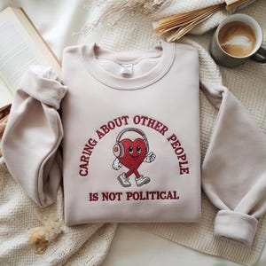 Embroidered Caring About Other People Is Not Political Sweatshirt, Vintage Cartoon Progressive Liberal Activist Heart Social Justice Tee