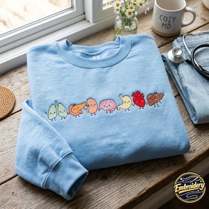 Broderad Organ Friends-tröja: Minimalistisk anatomi- och hälsovårdströja