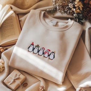 Embroidered Christmas Penguin Sweatshirt, Reindeer Penguin Hoodie, Festive Animal Crewneck, Penguin Lover Gift, Holiday Bird Tee