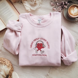 Embroidered Caring About Other People Is Not Political Sweatshirt, Vintage Cartoon Progressive Liberal Activist Heart Social Justice Tee