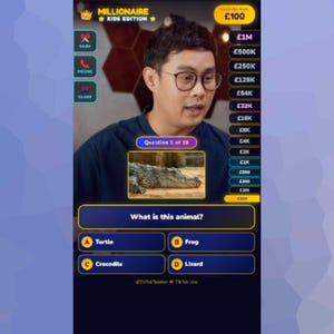 May include: A screenshot from a game show, "MILLIONAIRE KIDS EDITION", featuring a question about an animal. The options are Turtle, Frog, Crocodile, and Lizard. The host is wearing glasses and looking at the screen.