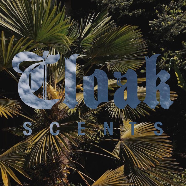 May include: A close-up of a palm tree with the text "Oak Scents" in a blue and white font.