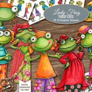 May include: A collection of Lady Frog fussy cuts featuring 11 printable sheets of illustrated green frogs wearing colorful hats and dresses with floral patterns. The set includes various frog characters and a pair of vintage-style metal scissors.