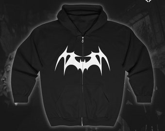 May include: Black zip-up hoodie featuring a white stylised bat design on the front.