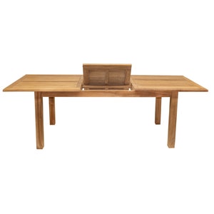 Könnte beinhalten: Ein Esstisch aus Holz mit einer Einlegeplatte. Der Tisch ist aus Naturholz und hat eine rechteckige Form. Die Einlegeplatte ist geöffnet und zeigt den Stauraum darunter.