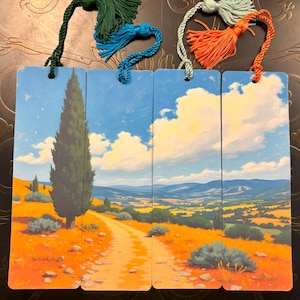 May include: Set of four landscape-themed bookmarks with colorful tassels. Each bookmark features a different section of a scenic painting of a road winding through a field, under a blue sky with fluffy clouds. Tassels are green, blue, orange, and light green.