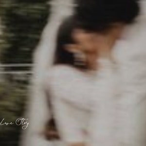 May include: A couple in white clothing is embracing, with the text "I DO" and "Welcome To Our Love Story" in white lettering on a green background.