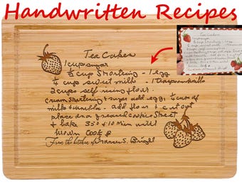 May include: A rectangular bamboo cutting board engraved with a handwritten recipe for Tea Cakes. The text includes ingredients and instructions, accompanied by illustrations of strawberries. A small inset shows the original handwritten recipe card.