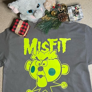 Charlie-in-the-box T-Shirt | Island of Misfit Toys Graphic Tee | Vintage Style | Unisex Apparel for Toy Lovers | Music Lovers |retro classic