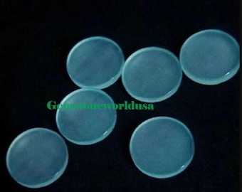 May include: Six round, translucent, light blue cabochons. The cabochons are smooth and polished.