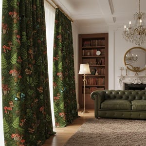 May include: Dark green curtains with a forest design featuring red and white mushrooms, ferns, and other foliage. The curtains are hanging in a room with a green leather sofa, a chandelier, and a bookshelf.